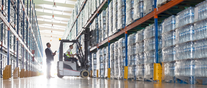 man operating a forklift in a warehouse